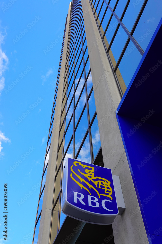 Fototapeta premium TORONTO - OCT 11: Sign of RBC (Royal Bank of Canada) at branch office in Toronto on Oct 11 2025. RBC is a Canadian multinational financial services company. 