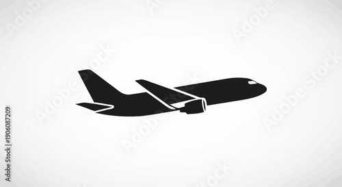 Black silhouette of a commercial airplane taking off or landing.