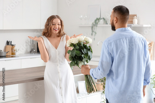 Surprised young woman recei...