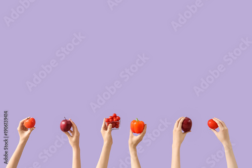 Hands holding fresh red veg...