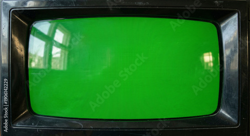 Wallpaper Mural Close-up view of a vintage CRT television screen showing a solid green background, ready for compositing and visual effects. Torontodigital.ca