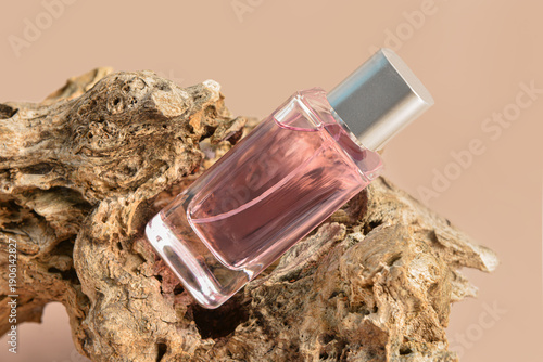 Pink bottle of perfume and ...