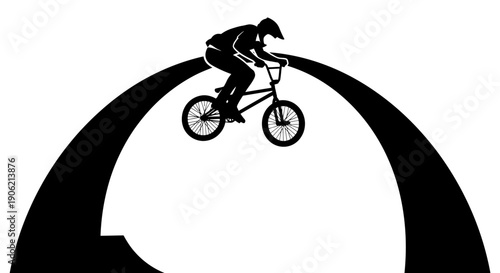 Cyclist in mid-air performing a stunt on a bicycle against a dark archway silhouette