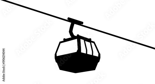 Cable car suspended high above the ground on a cable, viewed from below, illustrating transportation technology.
