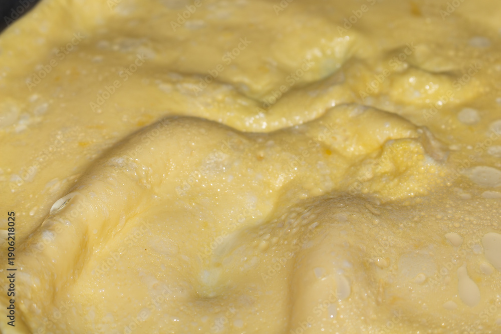 Obraz premium Delicious golden fried pastry with a soft texture and glistening surface represents traditional cuisine