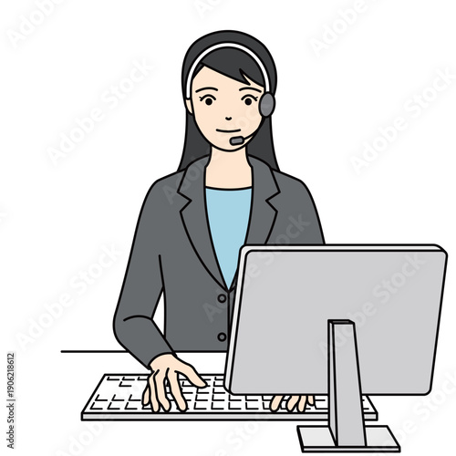 笑顔でパソコン入力を行うスーツ姿の女性オペレーター
