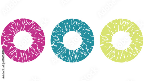Colorful contact lenses in pink, blue, and green on white background