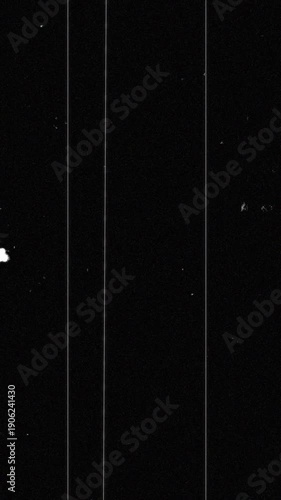 Noise, dirt, dust, scratches and grain on old damaged film surface. Old film look, tv signal with white vertical bad interference, static noise background.