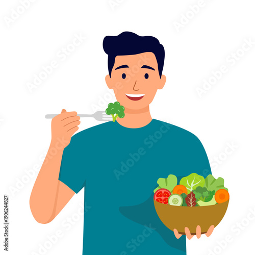 Young happy man eating salad on white background. Concept of healthy lifestyle, diet, waist loss, fresh meal, cooking, clean food, low calorie.
