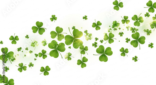 Green four leaf clovers floating in air with bright light on white background symbolizing luck and nature for st patrick's day or good fortune concepts