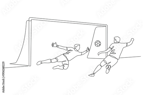 A soccer player kicks the ball as the goalkeeper dives to make a save in a competitive match.