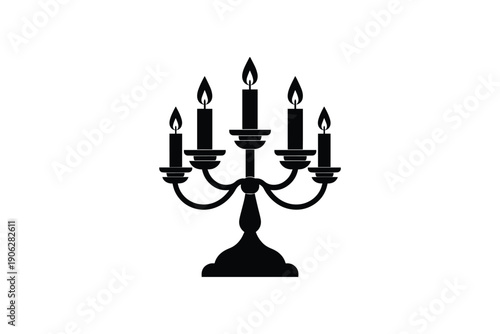 Ornate five-branched candelabra with lit candles on white background, vintage decoration element