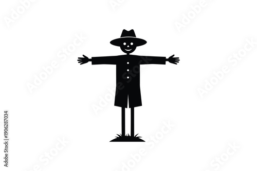 Black silhouette of a happy scarecrow wearing a hat, standing with arms outstretched in a field