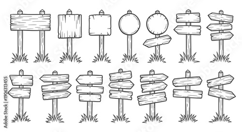 Set of wooden blank signs on grassy posts for direction or advertising