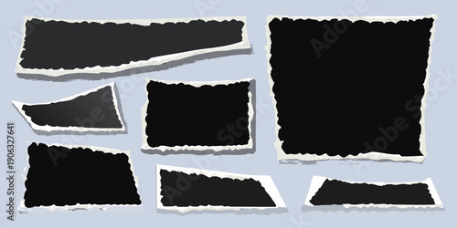 Collection of torn black paper scraps with white edges on a blue background