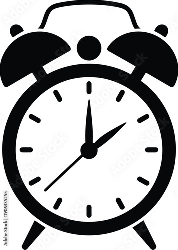 A black and white image of an old fashioned alarm clock