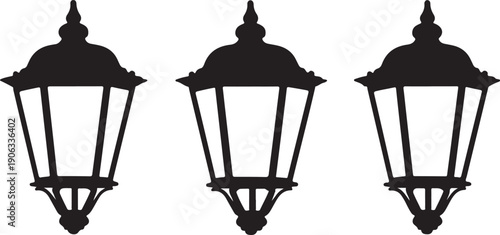 Black silhouette of three identical vintage style street lamps