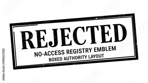 Rejected Stamp: A close-up shot of a stark black rectangular stamp with bold white lettering on it. The stamp is centered and commands attention.