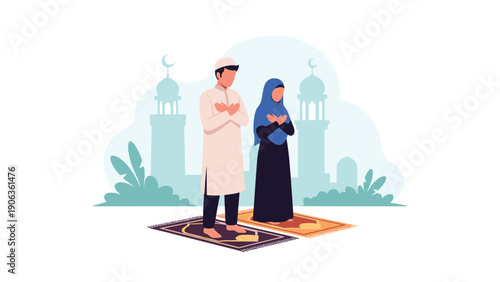 Muslim couple standing on prayer mats and performing Salah with their hands crossed in front of a mosque silhouette.