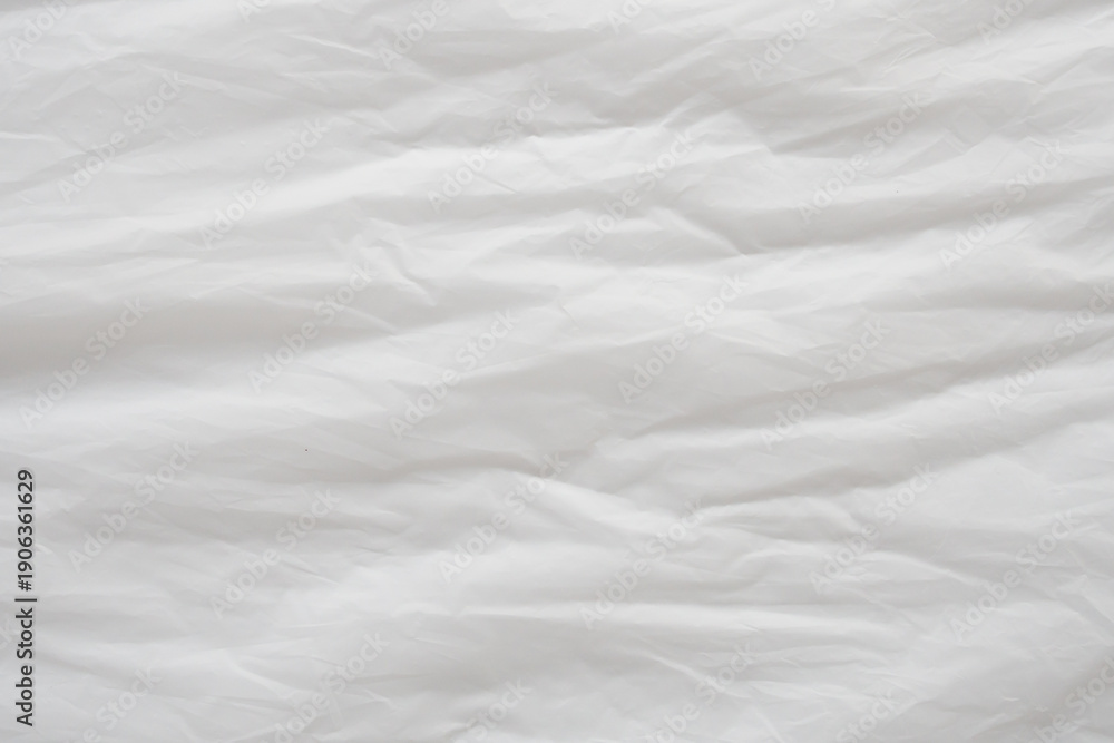 Obraz premium Crumpled White Plastic Sheet Surface Texture Background