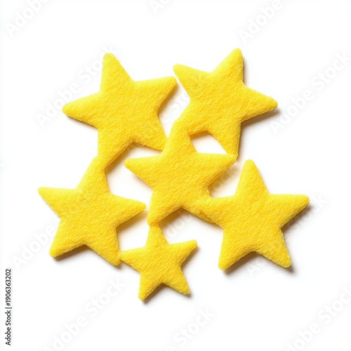 Cluster Of Five Yellow Glitter Stars Scattered On A White Background