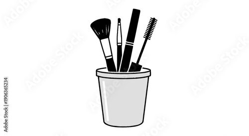 A set of makeup brushes in a cup.