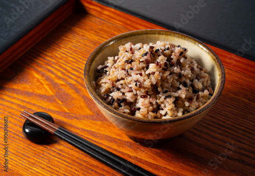 Schilderij op canvas Healthy Japanese mixed grain rice (Zakkoku-mai) in a ceramic bowl on a wooden tr