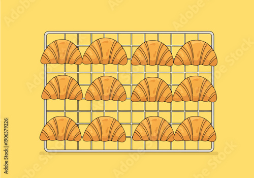 Twelve golden baked croissants arranged in rows on a cooling rack with a pale yellow background representing breakfast or bakery freshness