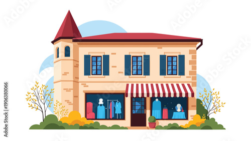 Elegant boutique clothing shop situated in a charming historic-style building with a pointed tower and colorful dress displays in windows.