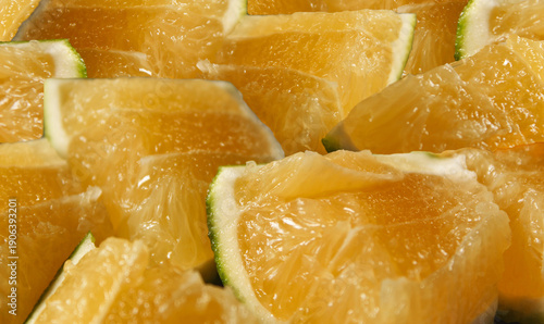 Fresh sweet lime citrus fruit background. Pulpy and juicy orange citrus fruit seamless backdrop.