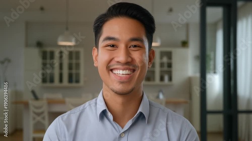 Head shot portrait of young Indian businessman, company head or executive manager dressed in casual shirt posing for camera standing.