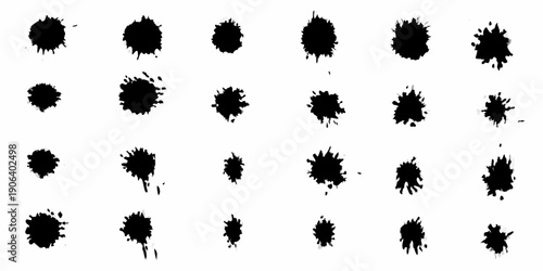 Abstract arrangement of irregular black ink blots on a white background