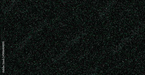 Shimmering dark emerald green glitter dust particles on black background texture.