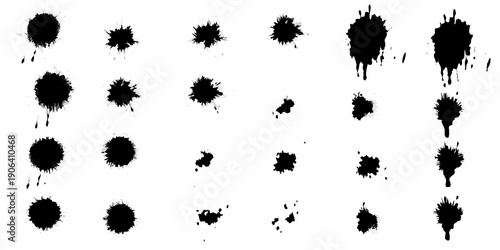 Abstract arrangement of black ink blots and splatters on white background