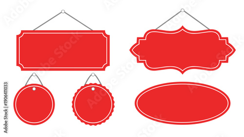 Assortment of blank red hanging signs and tags in various shapes including rectangular oval and scalloped circles for text.