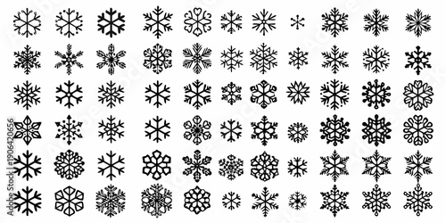 A dense collection of intricately designed black and white snowflakes