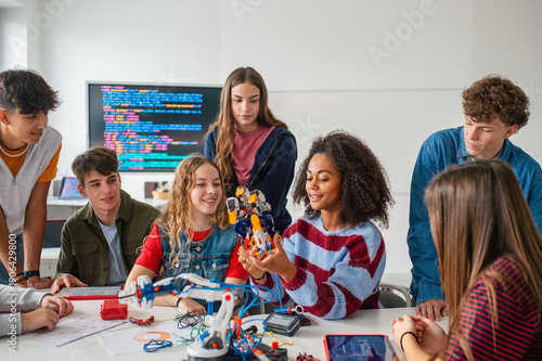 Diverse group of students working on engineering school project.