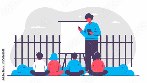 A man is giving a lecture to a group of people sitting on the ground in front of a fence using a whiteboard