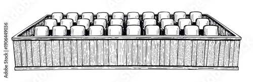 Numerous small square blocks neatly arranged in multiple rows inside a rustic wooden box, ideal for packaging, food products, or storagerelated commercial applications.