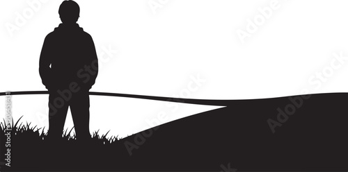 Silhouette of a man standing on a hill alone