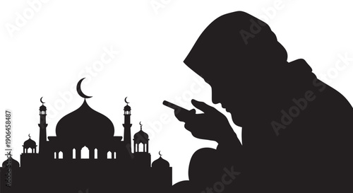 Muslim man praying with mobile phone near mosque silhouette