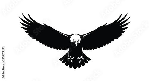 Black eagle silhouette in dramatic flying pose with white background in monochromatic lighting for logo design