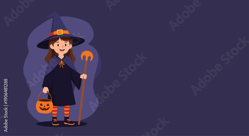 Little girl dressed in a purple witch costume for halloween holds a pumpkin bucket and a magic staff on dark background.
