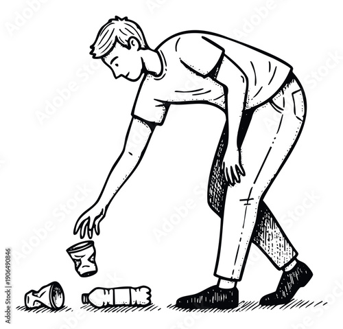 A young man demonstrates environmental responsibility by bending down to pick up discarded trash like a plastic bottle and cup, suitable for public service announcements or educational