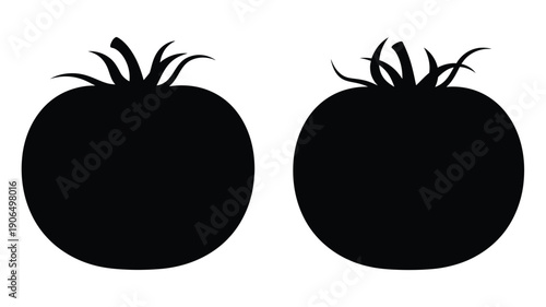 Two black tomato shapes are displayed in a stark silhouette