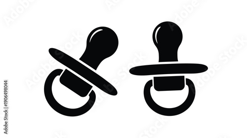 Two baby pacifiers depicted in a stark black silhouette