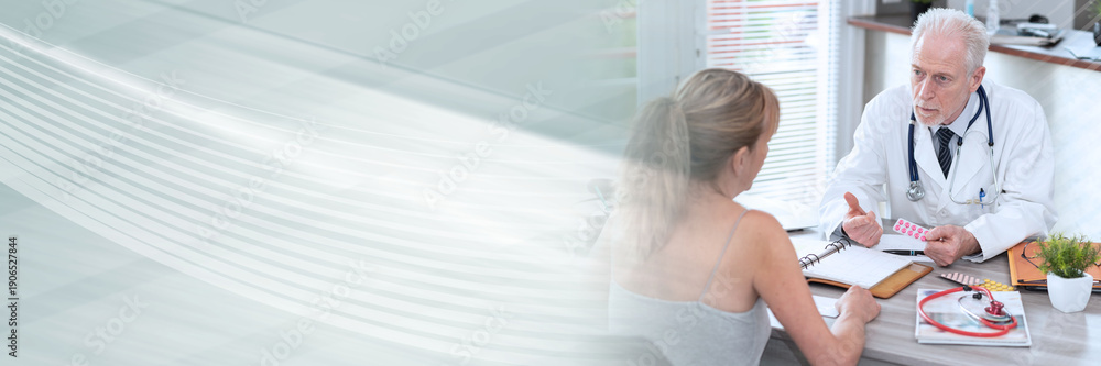 Fototapeta premium Senior doctor explaining treatment to his female patient; panoramic banner