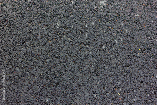 Vászonkép Close-up texture of wet new asphalt with large particles