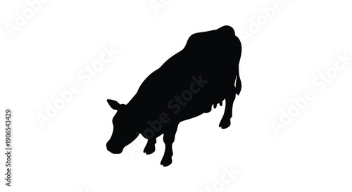 Silhouette of a cow grazing against a plain white background