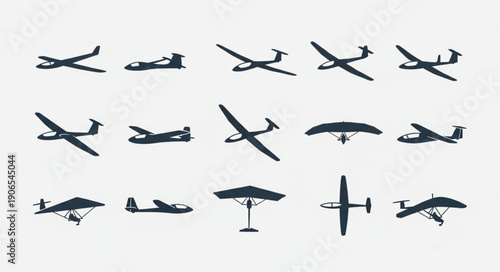 Collection of Silhouetted Aircraft and Gliders on White Background.